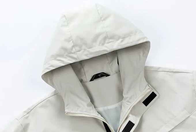 Waterproof Solid Color Raincoat Featuring a Drawstring Hem and Cargo Pockets