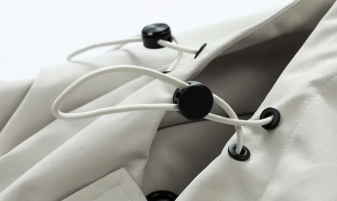Waterproof Solid Color Raincoat Featuring a Drawstring Hem and Cargo Pockets