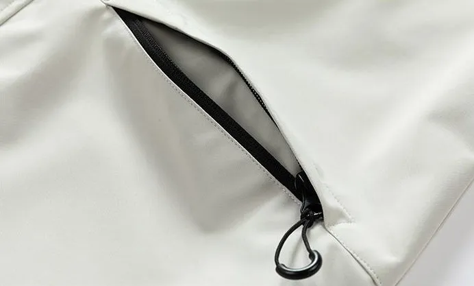 Waterproof Solid Color Raincoat Featuring a Drawstring Hem and Cargo Pockets