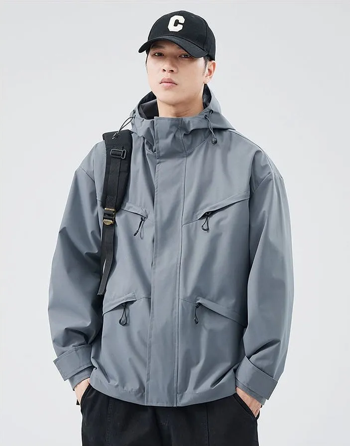 Waterproof Solid Color Raincoat Featuring a Drawstring Hem and Cargo Pockets