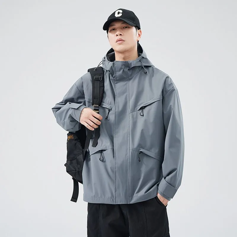 Waterproof Solid Color Raincoat Featuring a Drawstring Hem and Cargo Pockets