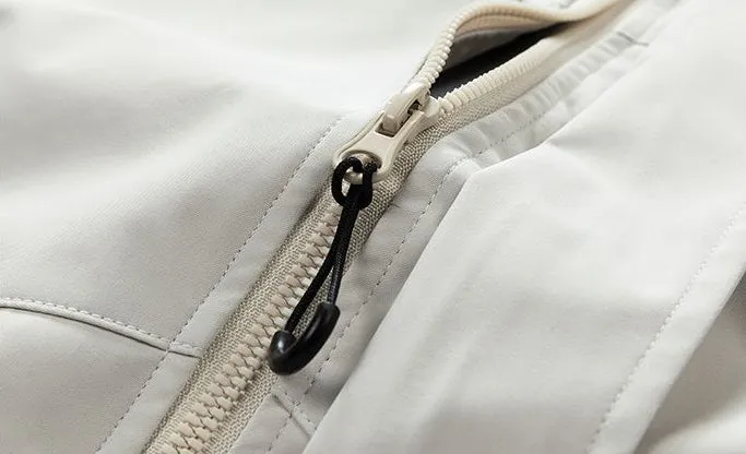 Waterproof Solid Color Raincoat Featuring a Drawstring Hem and Cargo Pockets