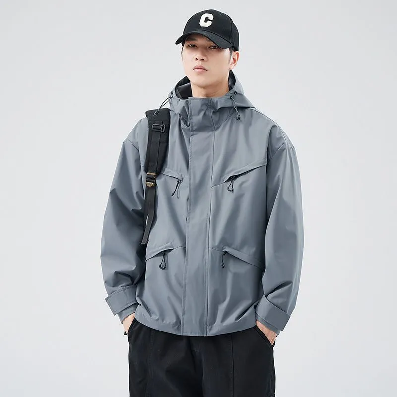 Waterproof Solid Color Raincoat Featuring a Drawstring Hem and Cargo Pockets