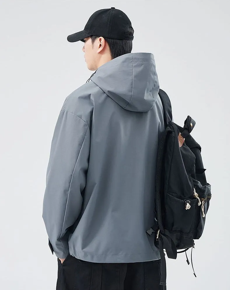 Waterproof Solid Color Raincoat Featuring a Drawstring Hem and Cargo Pockets