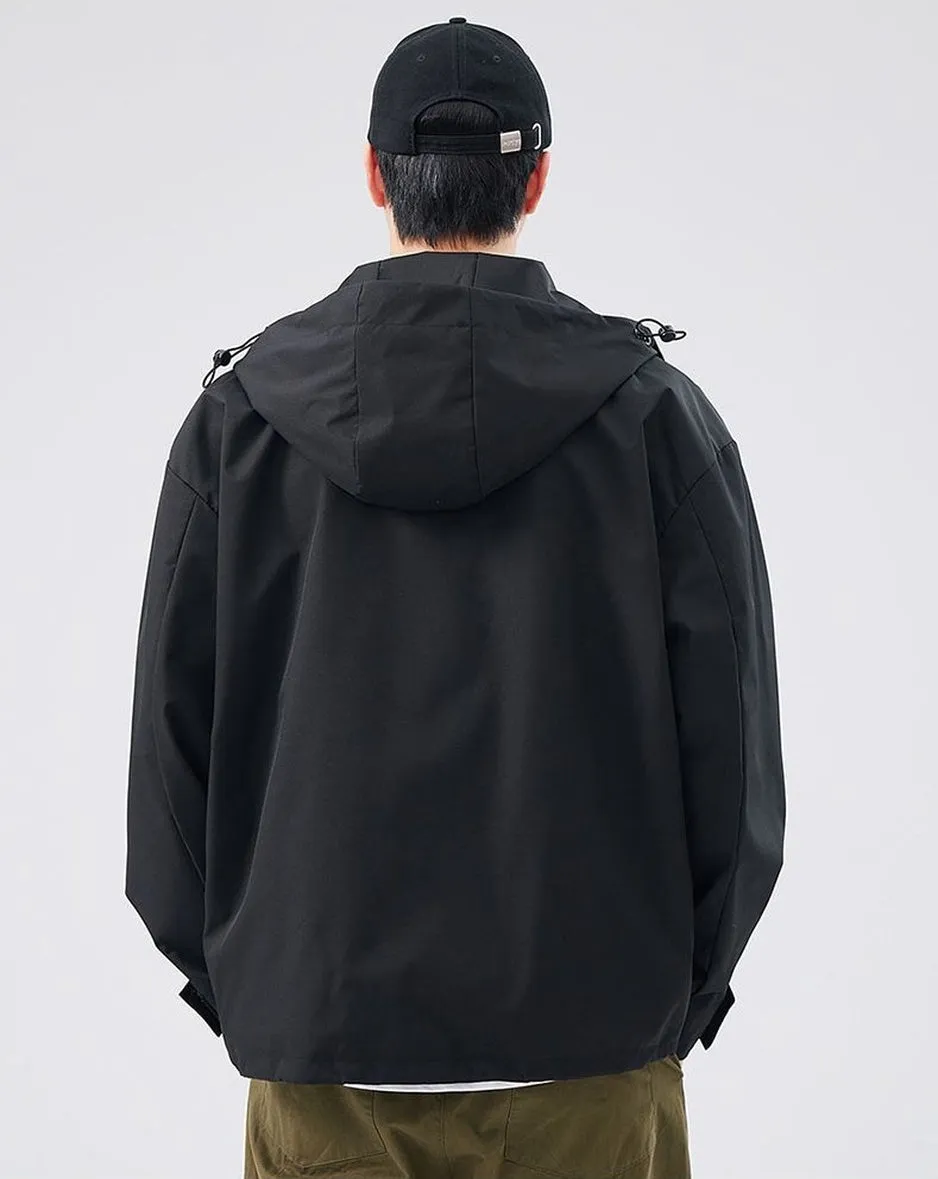 Waterproof Solid Color Raincoat Featuring a Drawstring Hem and Cargo Pockets